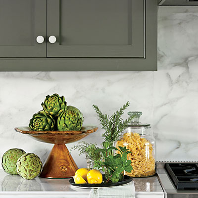 Artisan Stone Collection countertops and backsplash in Calacatta Gold Marble. 